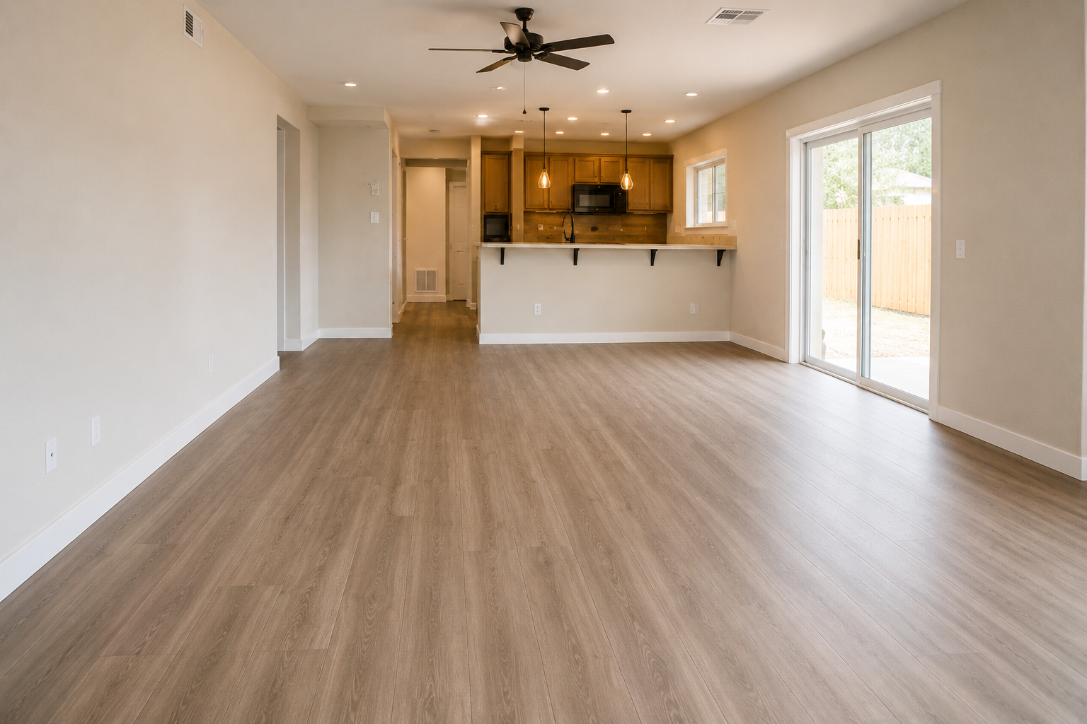 Finished tile flooring in open Florida home near kitchen and patio